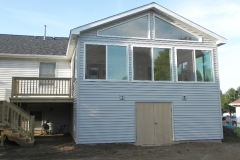 enclosed deck with shed to the backyard