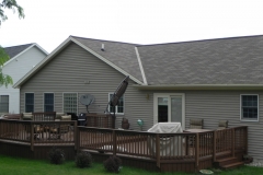 Low deck in the backyard one story house